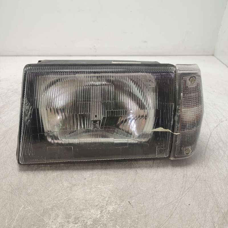 712035850009 faro fanale proiettore Lancia Prisma 1986-92 anteriore sinistro con fanalino freccia Carello