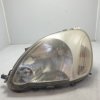 89008658 faro fanale proiettore ant SX Toyota Yaris MK1 P1 restyling 2003-05 un supporto danneggiato da lucidare